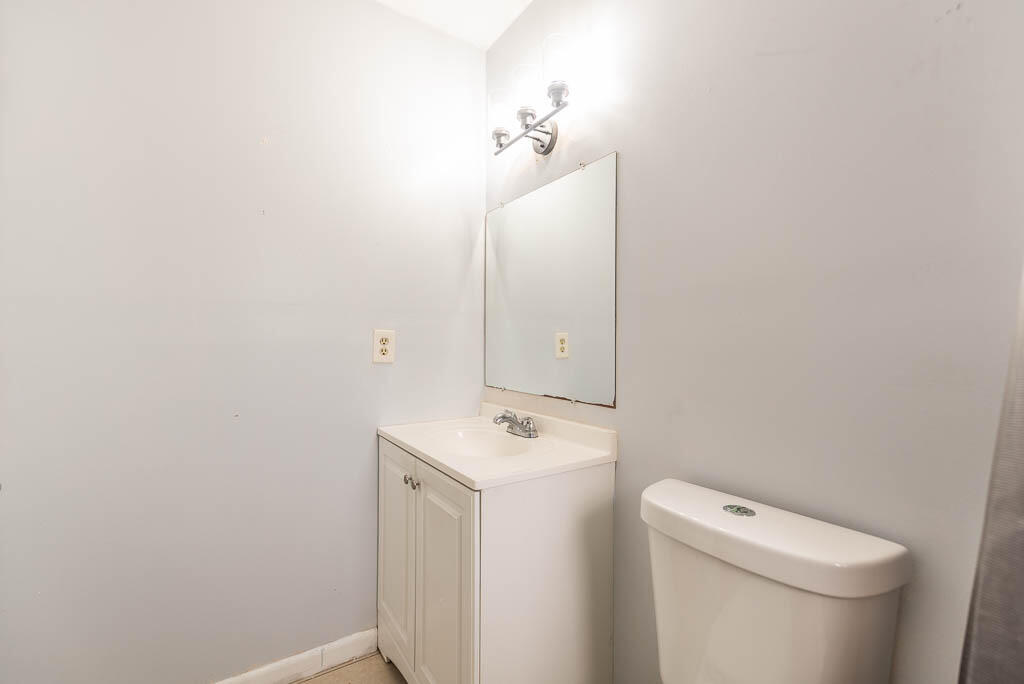 10225 Sleepy Brook Way Boca Raton, FL 33428 - Photo 23 of 41 a bathroom with a toilet a sink and mirror