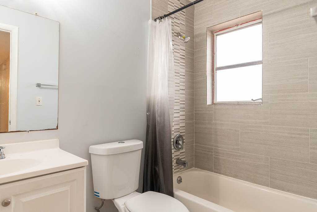 10225 Sleepy Brook Way Boca Raton, FL 33428 - Photo 25 of 41 a white toilet sitting next to a bath tub