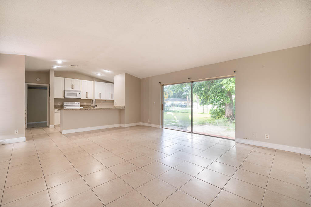 10225 Sleepy Brook Way Boca Raton, FL 33428 - Photo 26 of 41 a view of a kitchen with a sink and a window