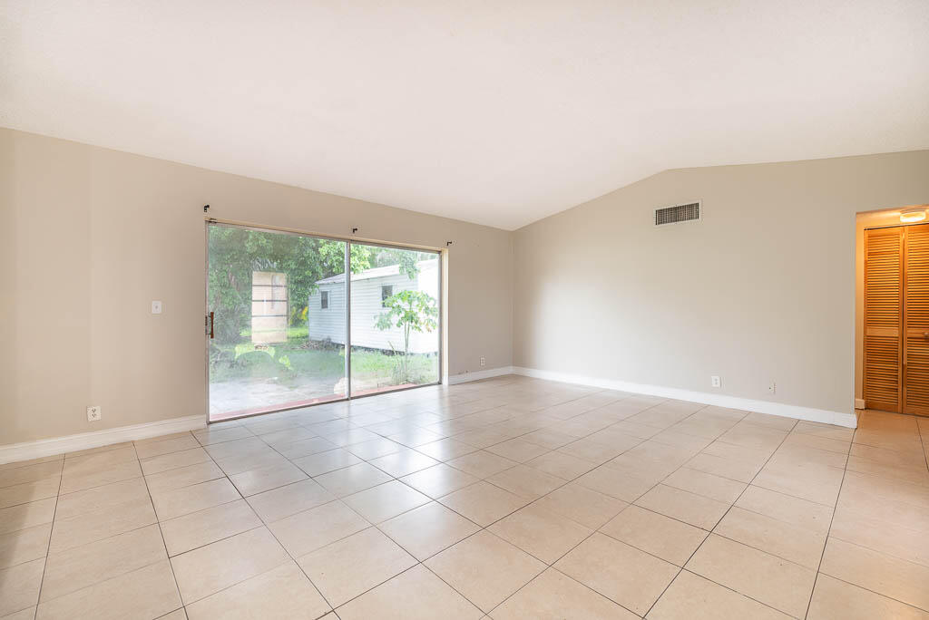 10225 Sleepy Brook Way Boca Raton, FL 33428 - Photo 27 of 41 a view of an empty room with glass door