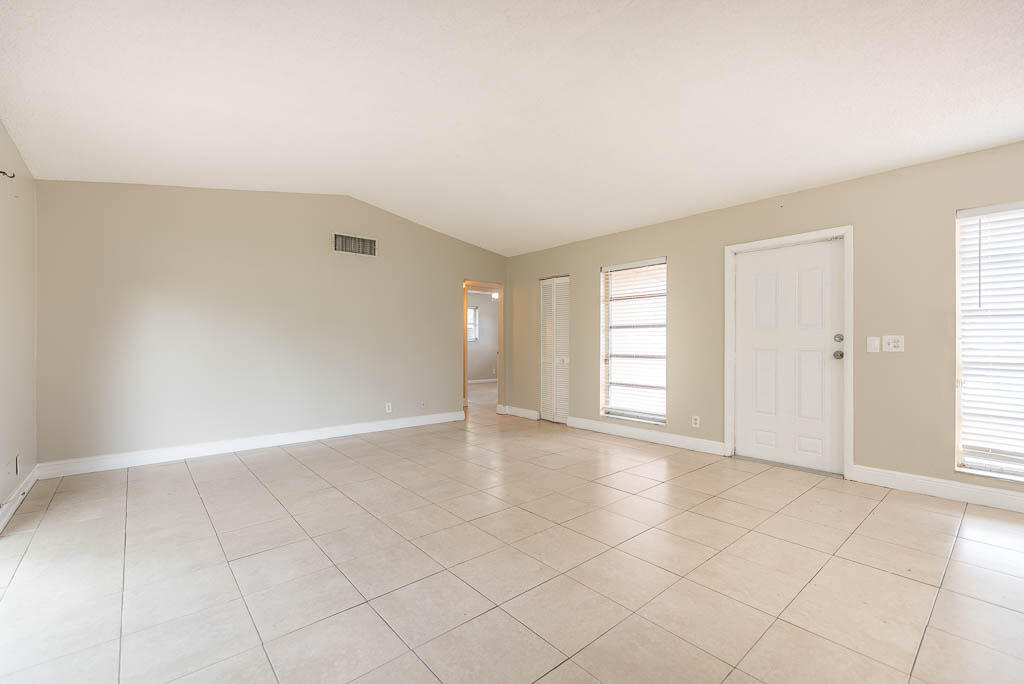 10225 Sleepy Brook Way Boca Raton, FL 33428 - Photo 28 of 41 an empty room with windows and closet