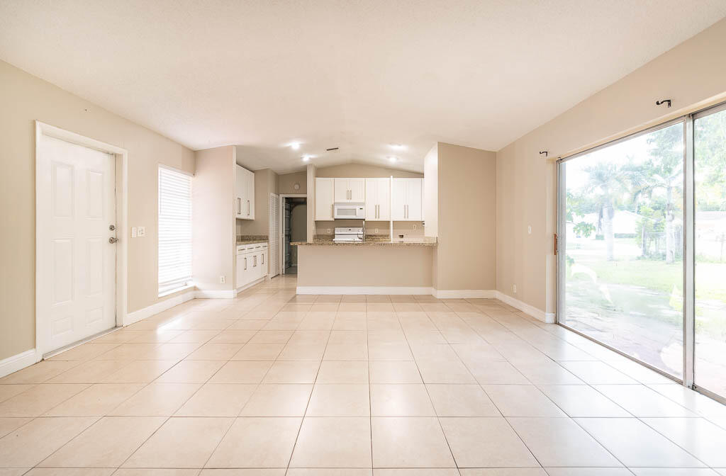 10225 Sleepy Brook Way Boca Raton, FL 33428 - Photo 30 of 41 a view of a kitchen with a sink and a window