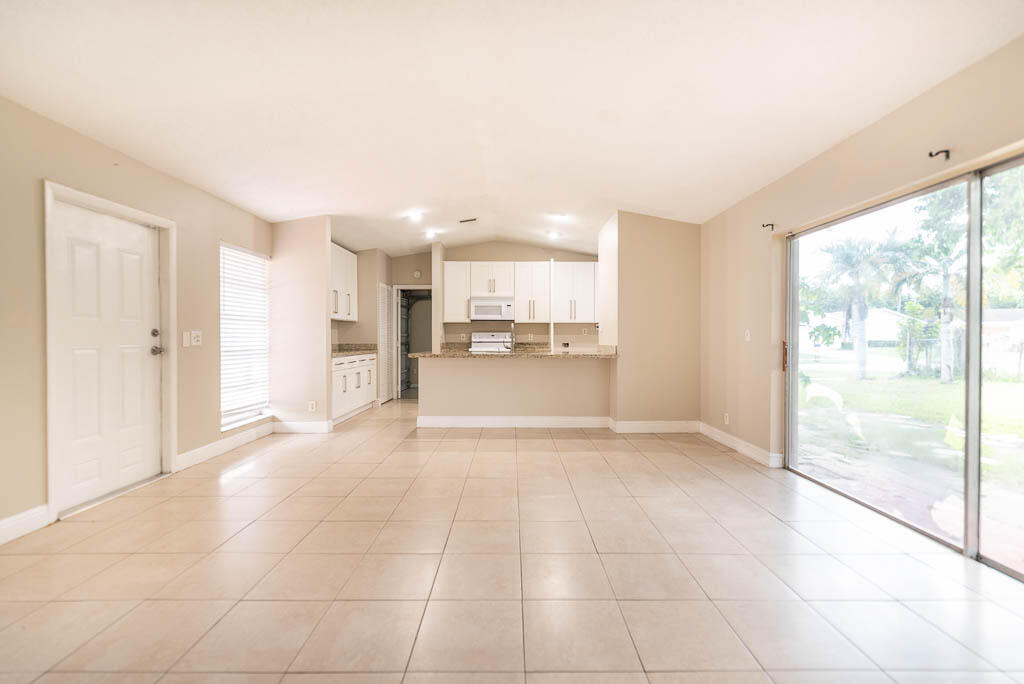 10225 Sleepy Brook Way Boca Raton, FL 33428 - Photo 32 of 41 a view of a kitchen with a sink and a window