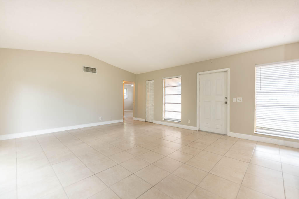10225 Sleepy Brook Way Boca Raton, FL 33428 - Photo 34 of 41 an empty room with windows and closet