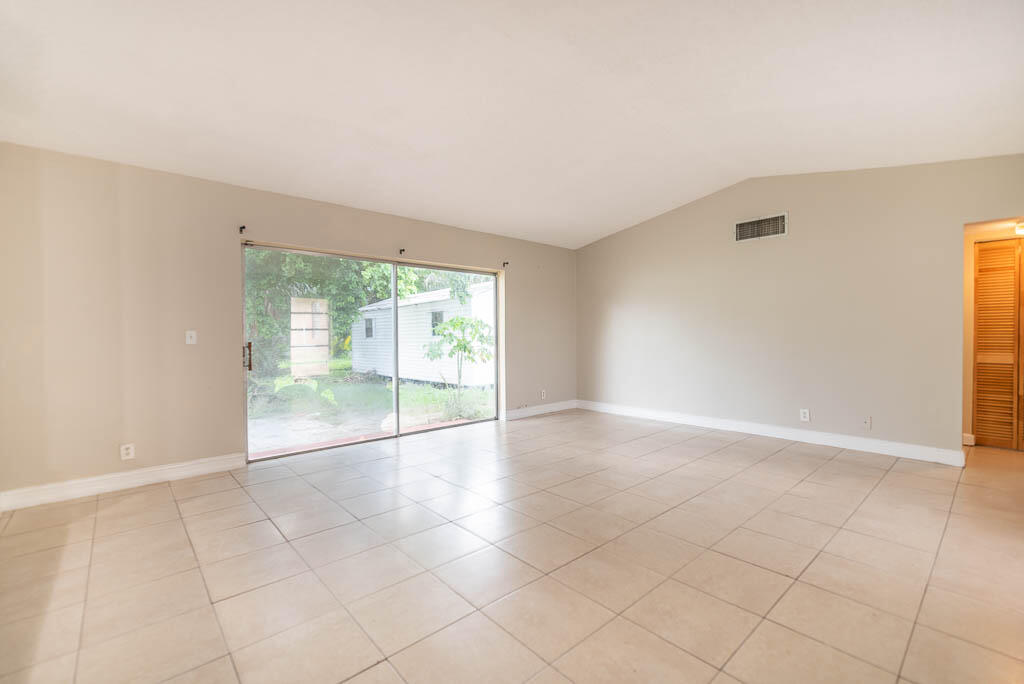 10225 Sleepy Brook Way Boca Raton, FL 33428 - Photo 35 of 41 a view of an empty room with a window