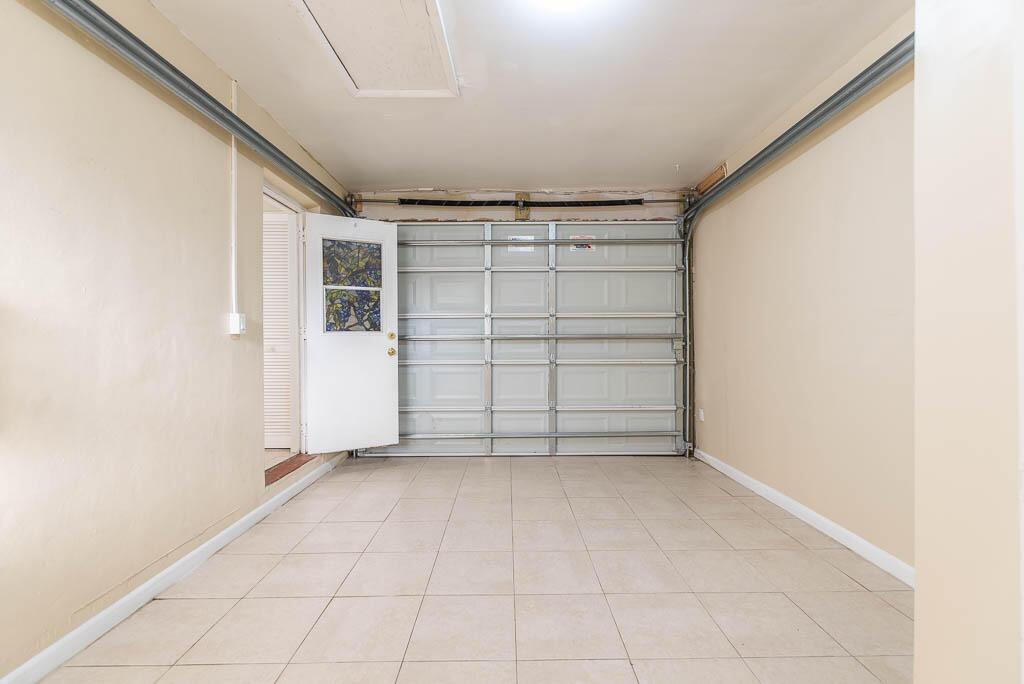 10225 Sleepy Brook Way Boca Raton, FL 33428 - Photo 36 of 41 an empty room with a empty space and windows