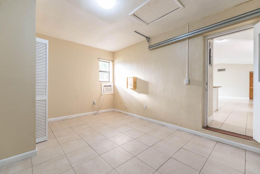 10225 Sleepy Brook Way Boca Raton, FL 33428 - Photo 38 of 41 an empty room with windows and closet