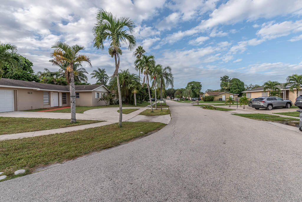 10225 Sleepy Brook Way Boca Raton, FL 33428 - Photo 39 of 41 a view of a street with a houses