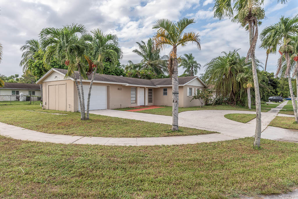 10225 Sleepy Brook Way Boca Raton, FL 33428 - Photo 40 of 41 a view of a house with backyard and house