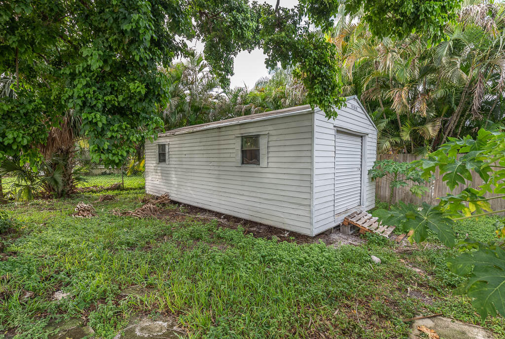 10225 Sleepy Brook Way Boca Raton, FL 33428 - Photo 7 of 41 a view of a backyard with potted plants and large tree