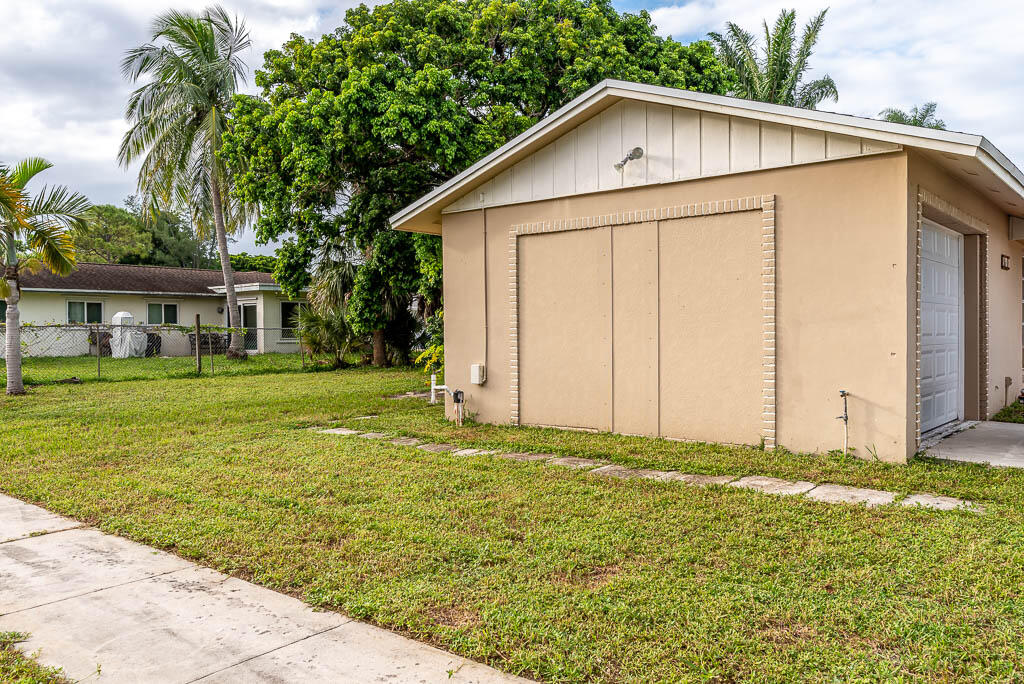 10225 Sleepy Brook Way Boca Raton, FL 33428 - Photo 10 of 41 a view of a house with a yard