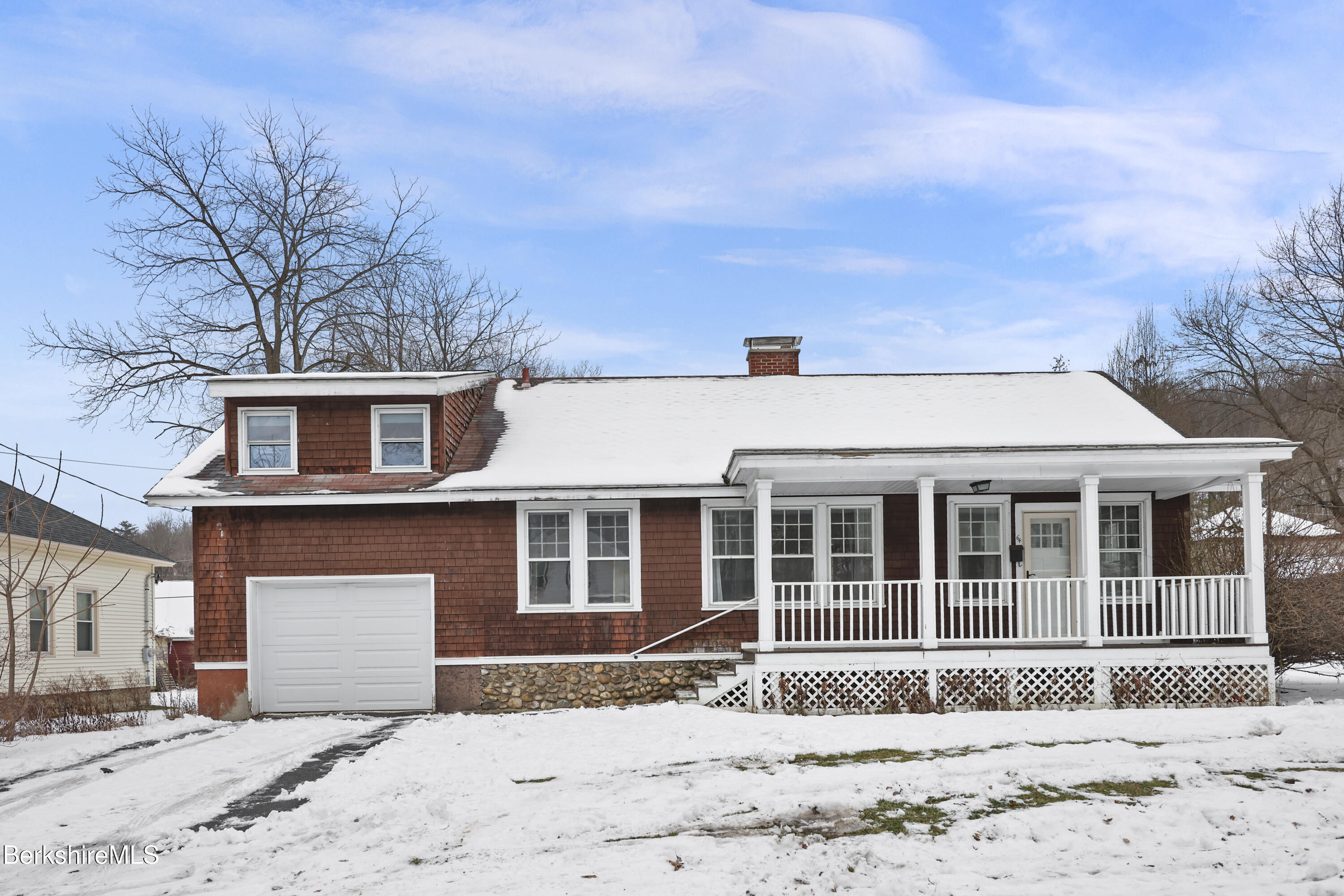 64 Notch Road North Adams, MA 01247 - Photo 1 of 37 a front view of a house with a yard covered in snow