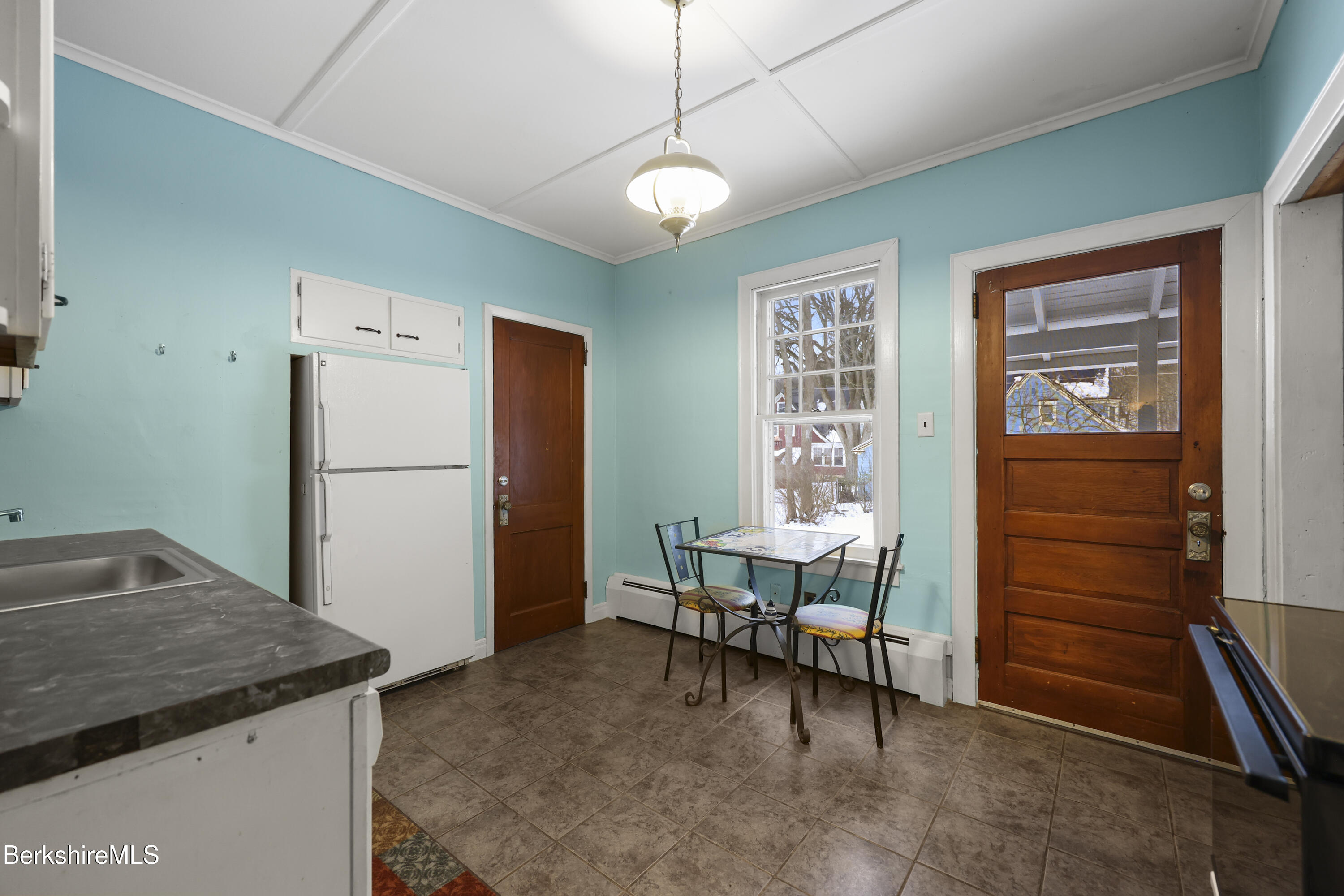 64 Notch Road North Adams, MA 01247 - Photo 14 of 37 a kitchen with refrigerator and table