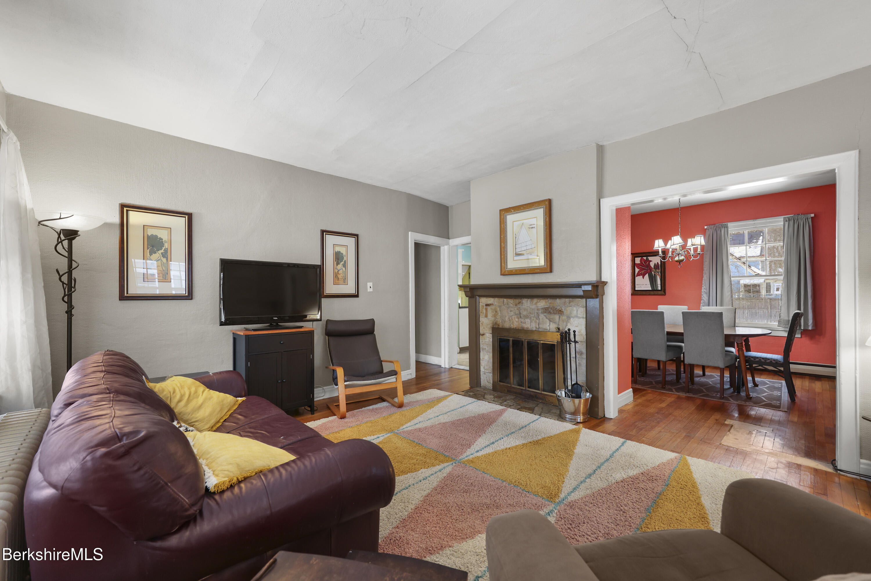 64 Notch Road North Adams, MA 01247 - Photo 4 of 37 a living room with furniture a fireplace and a flat screen tv