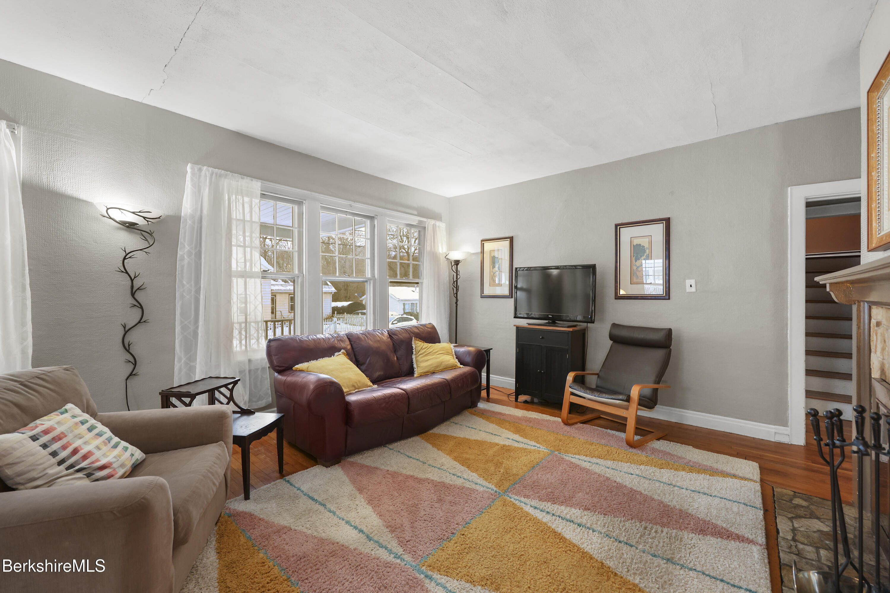 64 Notch Road North Adams, MA 01247 - Photo 6 of 37 a living room with furniture a lamp and a flat screen tv