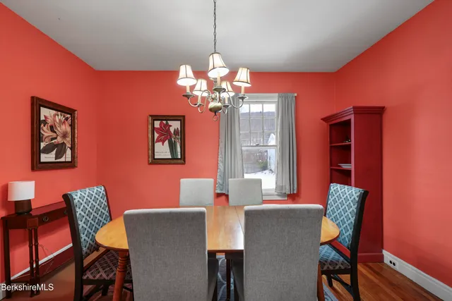a dining room with furniture and chandelier