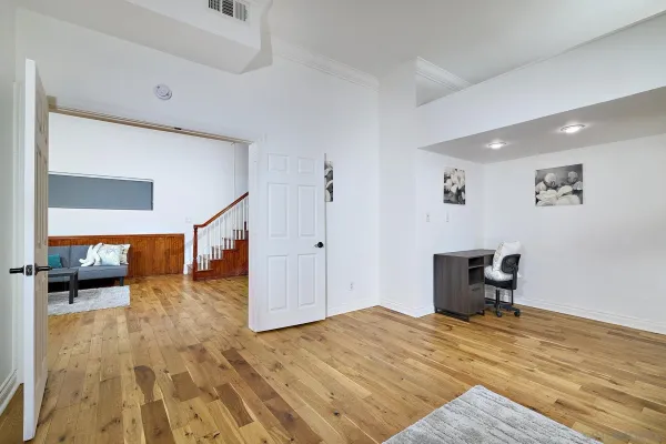 a bedroom that has a bed and a chair in it