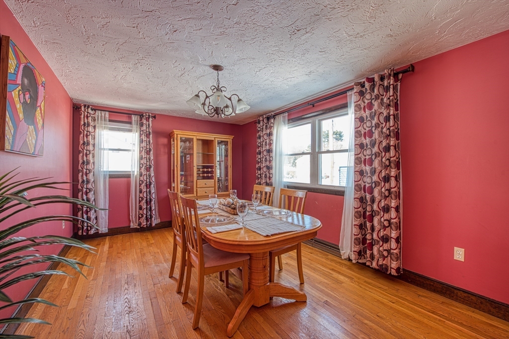 12 Brewster Road Randolph, MA 02368 - Photo 7 of 27 a view of a dining room with furniture window and wooden floor