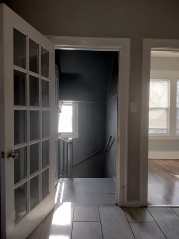 a view of storage and utility room with windows