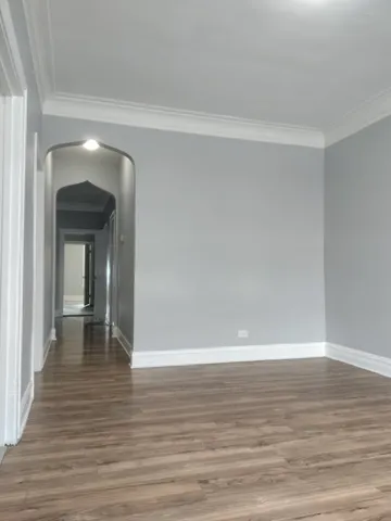 a view of a room with wooden floor