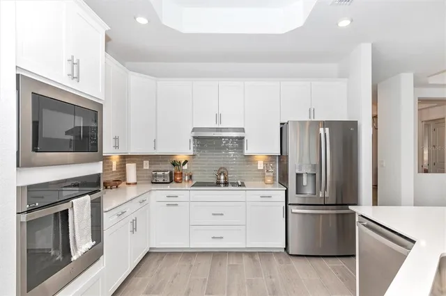 a living room with furniture a dining table and chairs