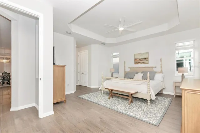 a bedroom with two beds and a table