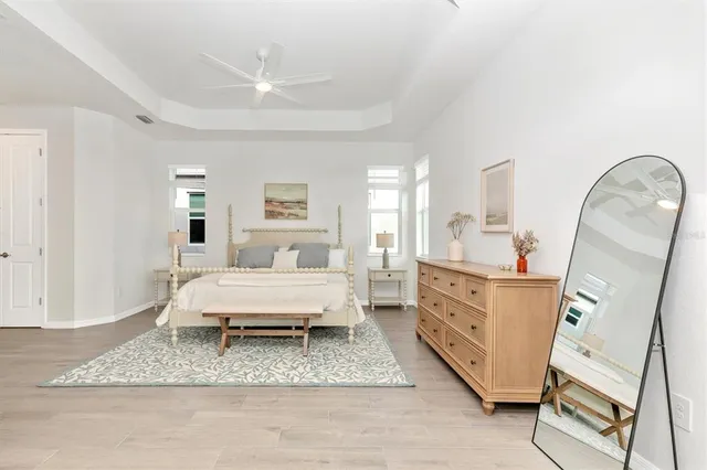 a bathroom with a toilet sink vanity and mirror