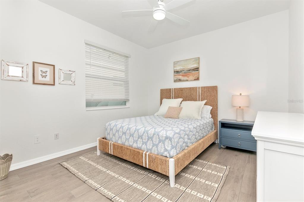 17672 Santorini Court Venice, FL 34293 - Photo 33 of 94 a bedroom with a bed and a window