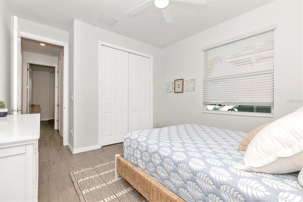 17672 Santorini Court Venice, FL 34293 - Photo 34 of 94 a bedroom with a large bed and a window