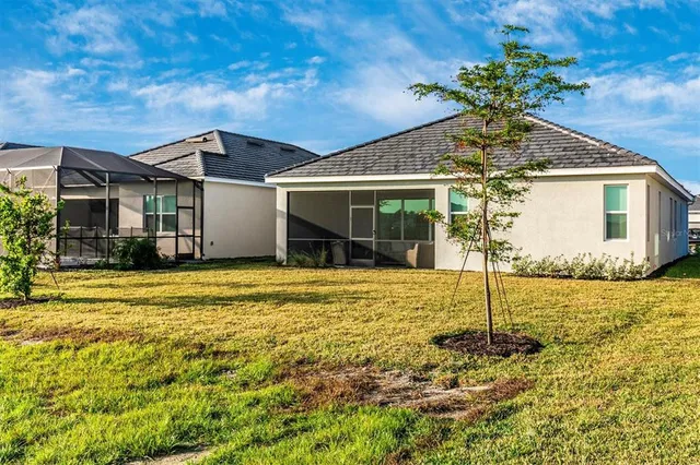 a living room with lots of furniture and a chandelier