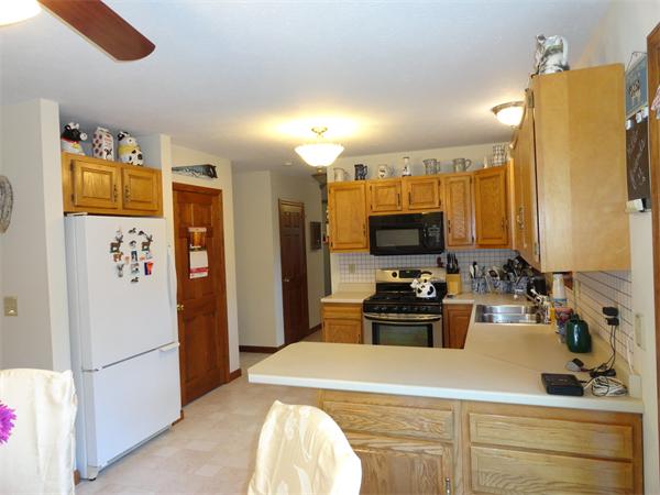 156 Fitchburg Road Townsend, MA 01469 - Photo 5 of 17 a kitchen with a refrigerator and a sink