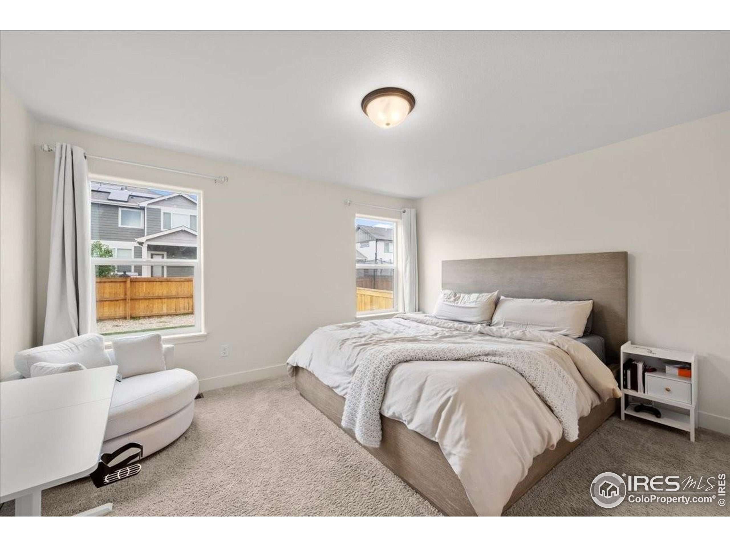 915 Milner Pass Road Severance, CO 80550 - Photo 12 of 20 a bedroom with a bed and couch