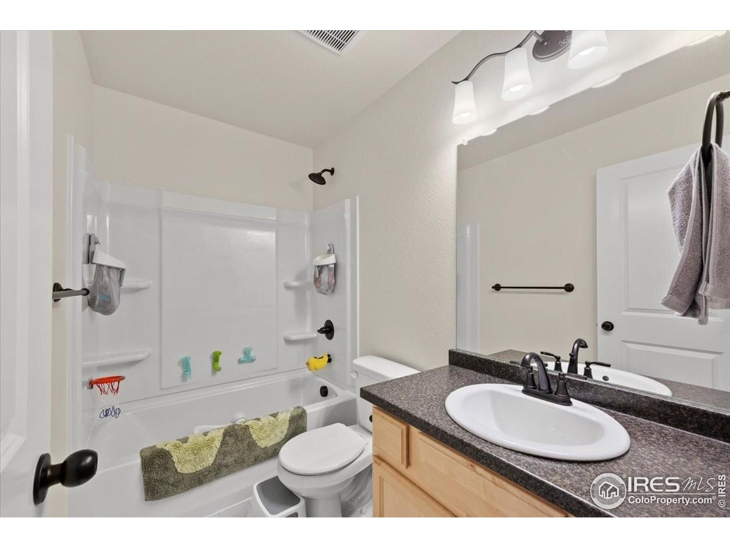 915 Milner Pass Road Severance, CO 80550 - Photo 15 of 20 a bathroom with a sink and a mirror