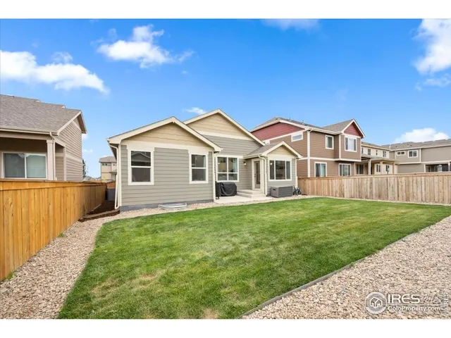 a view of a yard in front of house with a yard