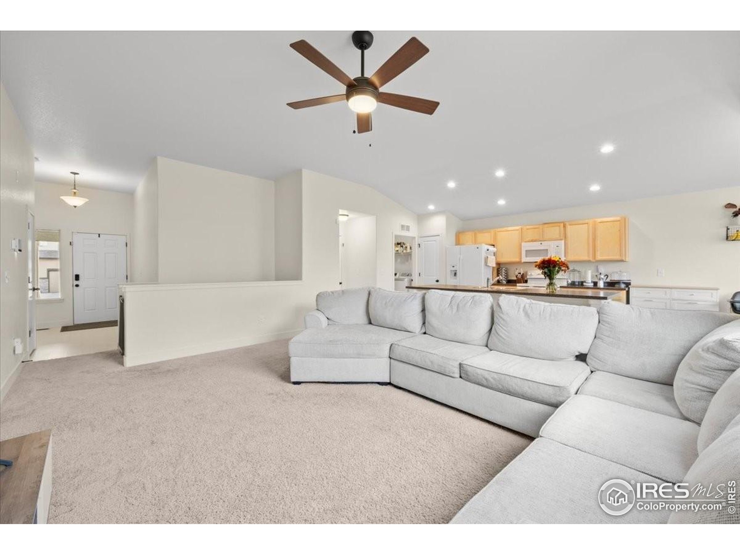 915 Milner Pass Road Severance, CO 80550 - Photo 4 of 20 a living room with furniture and kitchen view