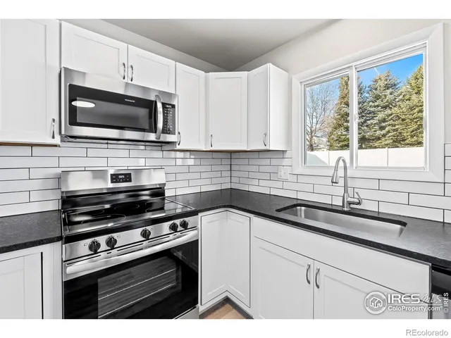 a bathroom with a shower and a sink