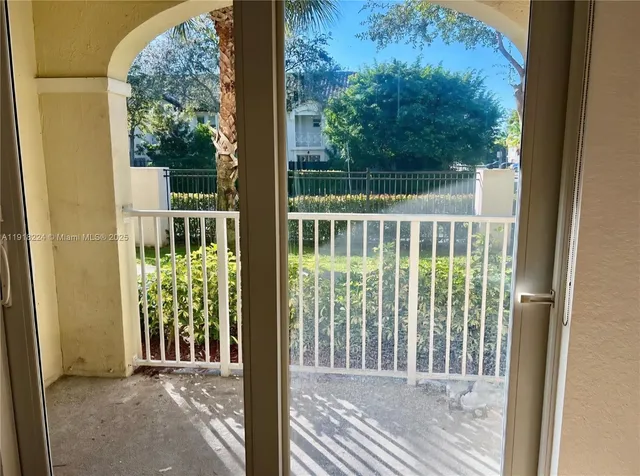 a view of porch with a small garden