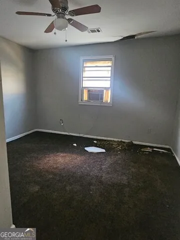 a view of hallway with wooden floor