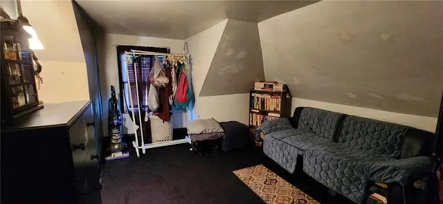 a view of walk in closet with clothes