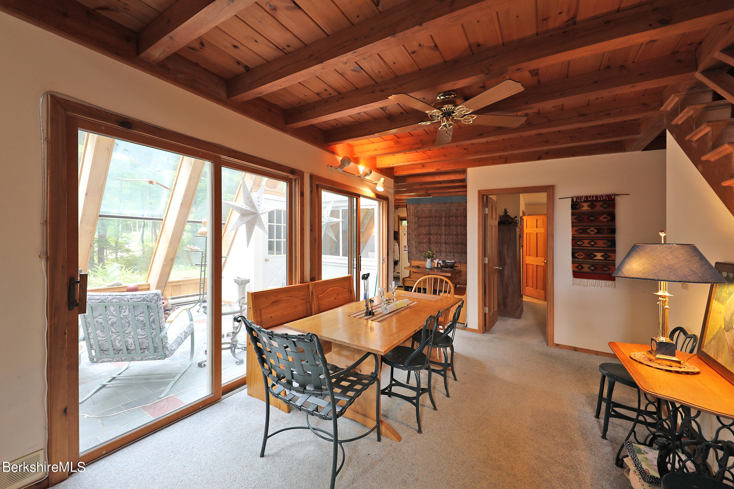 49 Reservoir Road Lenox, MA 01240 - Photo 14 of 30 a view of a dining room with furniture window and outside view