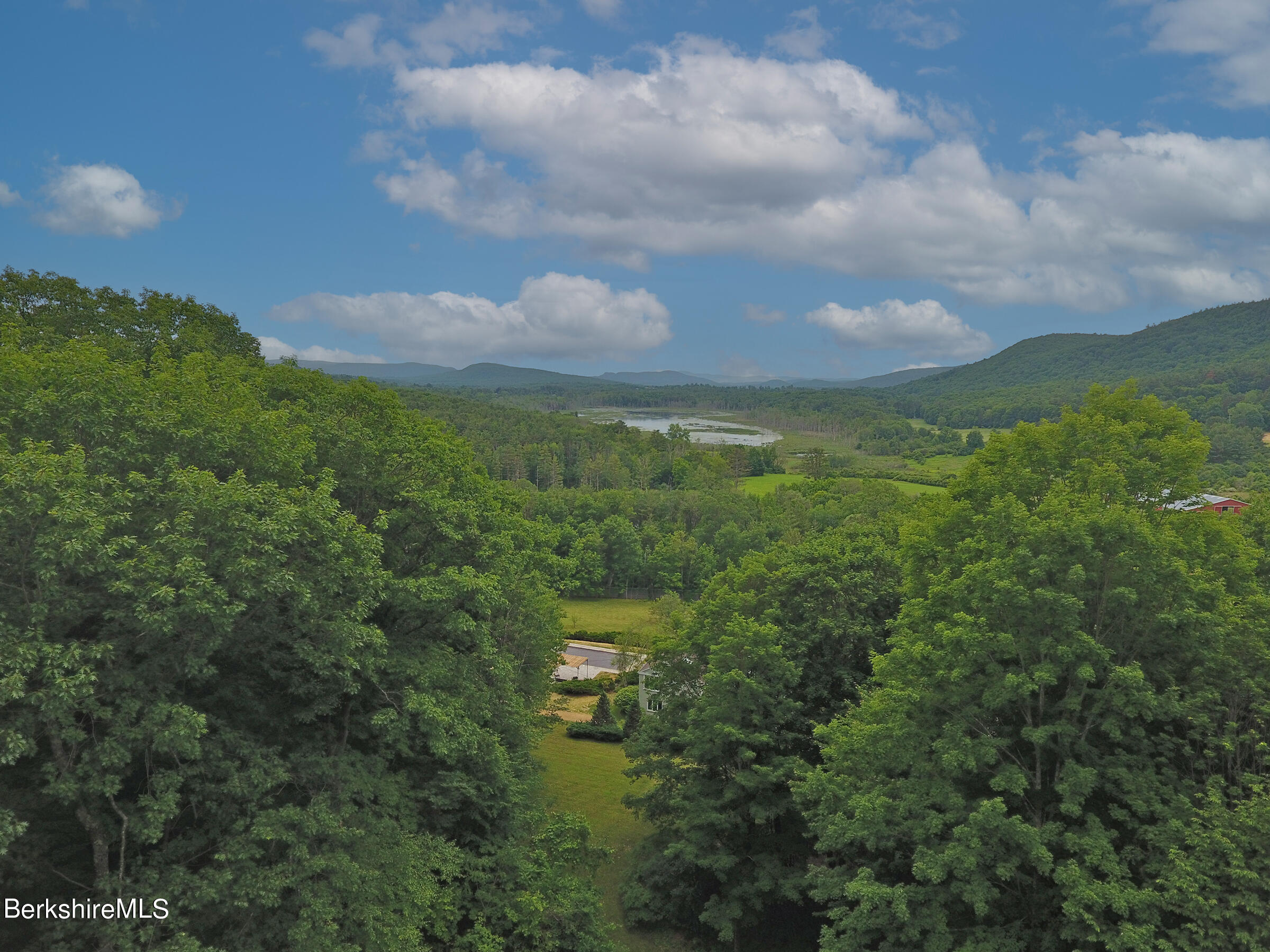 49 Reservoir Road Lenox, MA 01240 - Photo 29 of 30 a view of a city and mountain view in back