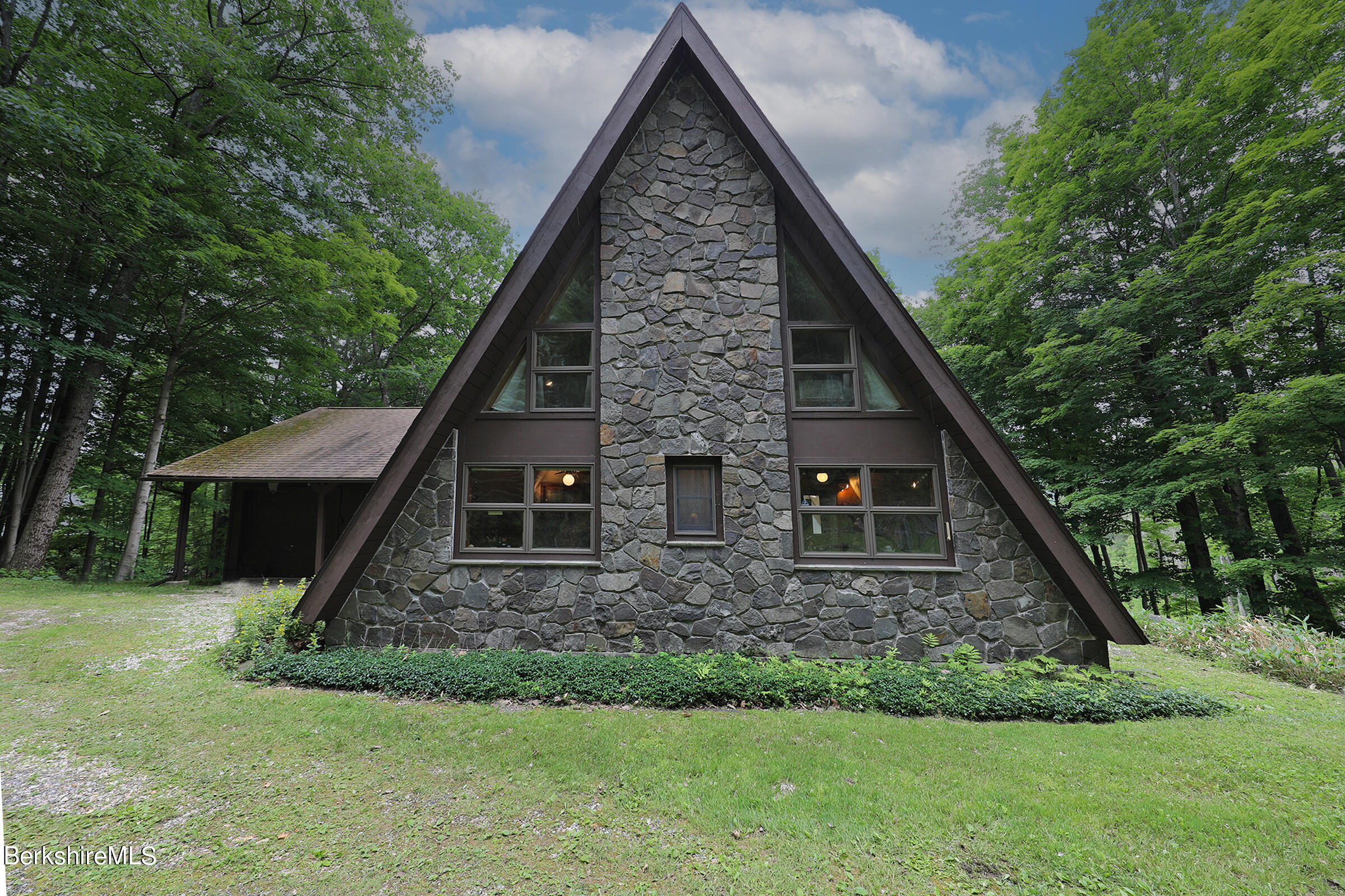 49 Reservoir Road Lenox, MA 01240 - Photo 4 of 30 front view of a house with a yard