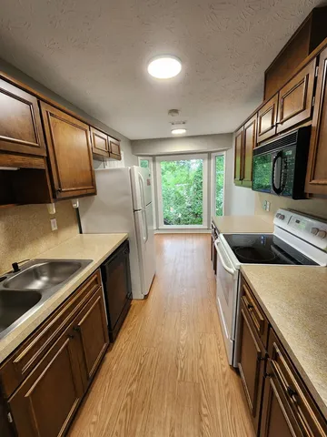 a kitchen that has a sink and a stove