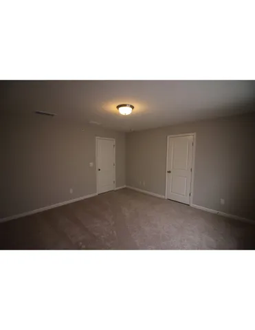 a open kitchen with a sink and cabinets