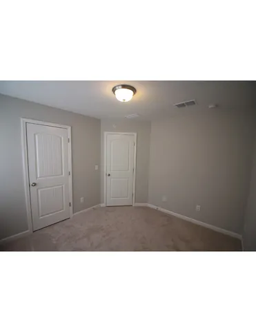 a black and white photo of a living room