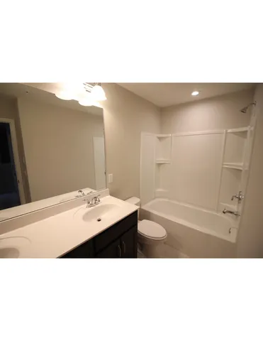 a bathroom with a sink and mirror