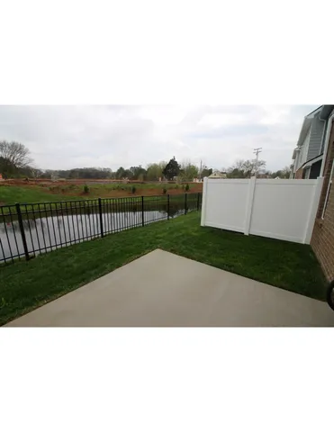 a view of house with outdoor space and swimming pool