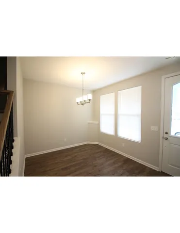 a black and white photo of a living room