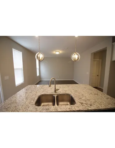 a bathroom with a sink a mirror and vanity
