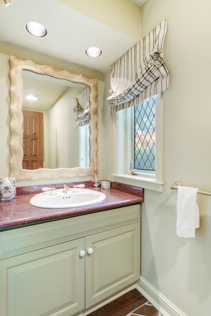 1490 Lake Road Lake Forest, IL 60045 - Photo 10 of 44 a bathroom with a sink and a mirror